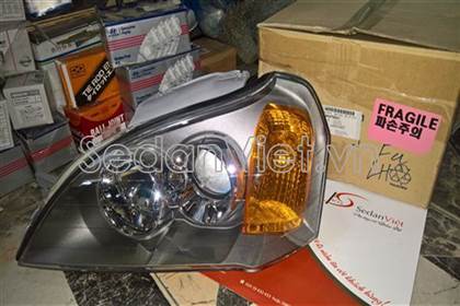 Vỏ đèn pha trái Daewoo Magnus 2004
